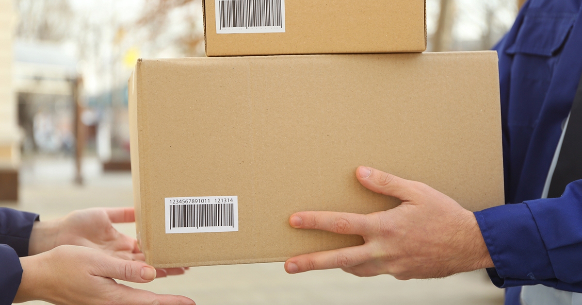 A closeup shot of packaged products being delivered to a satisfied customer.