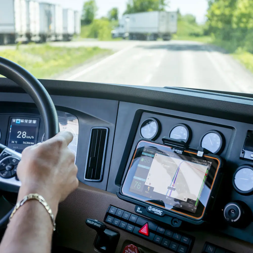 Driver using French-language interface on a rugged tablet for task tracking in fleet operations
